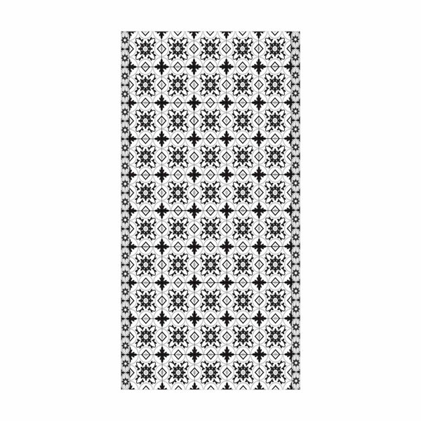 East Urban Home This black vinyl rug features a geometric mix of tiles Wayfair.co.uk